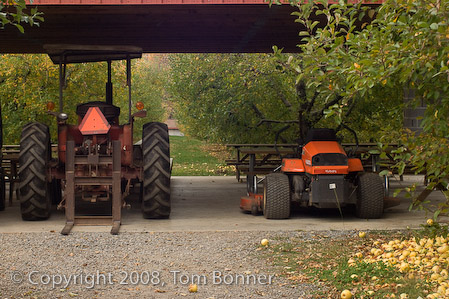 Farm equipment stored in the Apple Pickin' Picnic Shelter